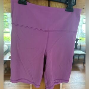 Athleta azalea colored work out shorts. Pocket in waist band. Size small.